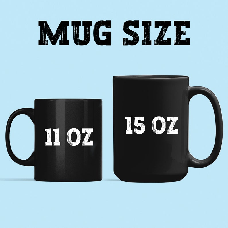 May include: Two black ceramic mugs with white text. The smaller mug is 11 oz and the larger mug is 15 oz.