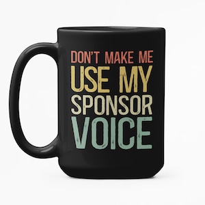 May include: Black coffee mug with a vintage-style graphic that says "Don't make me use my sponsor voice".