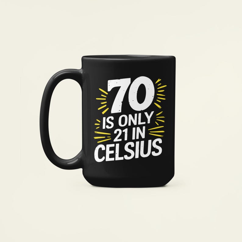 May include: Black ceramic mug with a white and yellow graphic that reads "70 is only 21 in Celsius". The mug has a large handle and a simple, classic design. A fun gift for a 70th birthday.