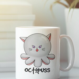 May include: White ceramic mug with a cartoon octopus with cat ears and purple eyes. The octopus is gray with pink tentacles. The text "octopus" is printed below the octopus.