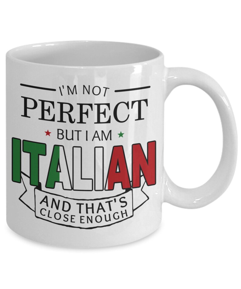 May include: White ceramic coffee mug with a black and red design. The mug features the text "I'm not perfect but I am Italian and that's close enough". The text is surrounded by a black line and a red, white, and green Italian flag.