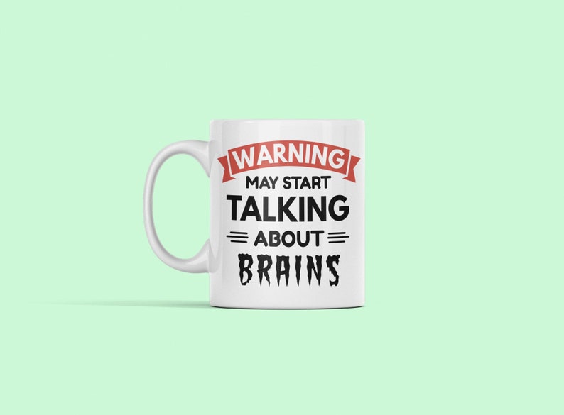 May include: White ceramic mug with a black and red design that says "WARNING MAY START TALKING ABOUT BRAINS".