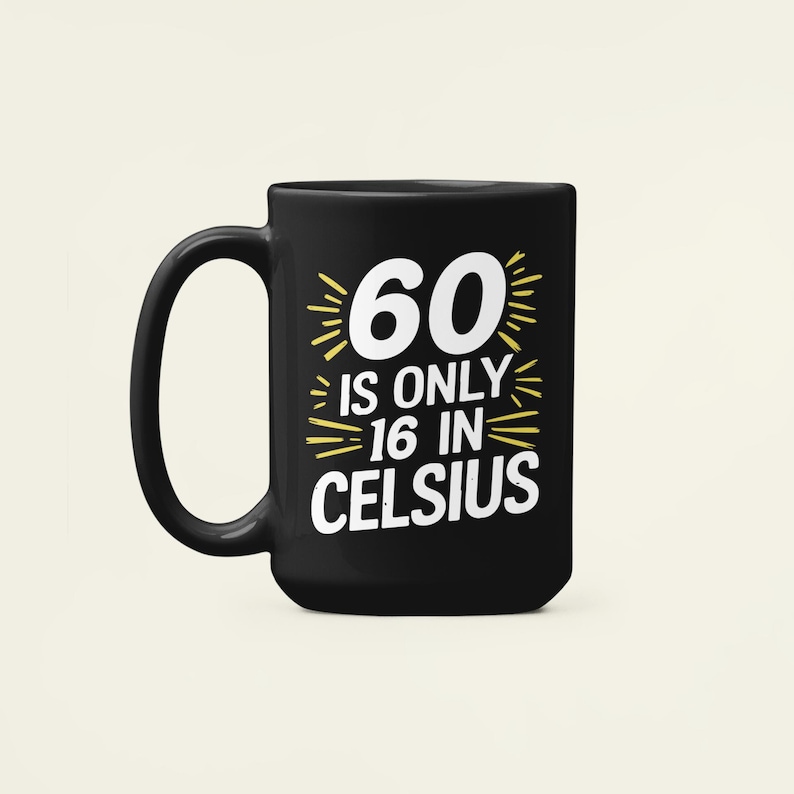 May include: A black ceramic mug with a white and yellow graphic. The graphic reads "60 is only 16 in Celsius". The mug has a large handle and a simple, classic design. A fun gift for a 60th birthday.