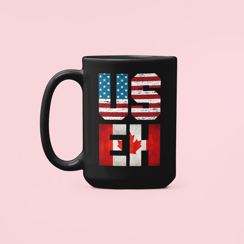 May include: Black coffee mug with a distressed American flag and Canadian flag design. The text "US EH" is printed on the mug.