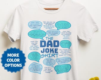May include: White t-shirt with a blue and light blue design featuring a variety of dad jokes in speech bubbles. The text "The Dad Joke Shirt" is in large blue letters.