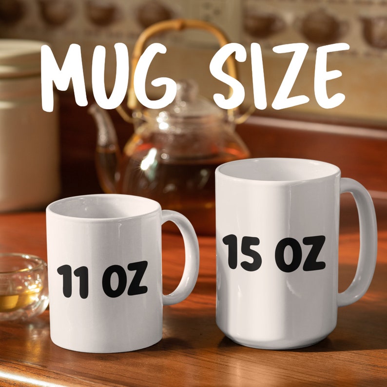 May include: Two white ceramic mugs with black text. The smaller mug is 11 oz and the larger mug is 15 oz.