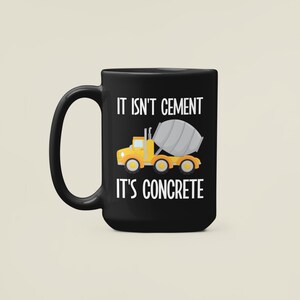 May include: Black coffee mug with a white graphic of a yellow cement mixer truck and the text "It isn't cement it's concrete".