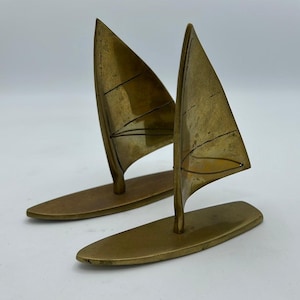 Two small messing windsurfing boards