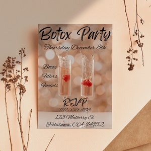 May include: A brown paper envelope with a white card inside. The card is an invitation to a Botox party on Thursday, 8th December. The card features a photo of two champagne glasses with a red berry in each glass. The text on the card reads "Botox Party", "Thursday December 8th", "Botox", "Fillers", "Facials", "RSVP", "707-555-4718", "123 Mulberry St", and "Petaluma, CA. 14952".