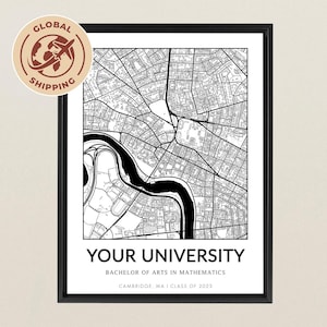 May include: A framed black and white map print featuring a detailed street grid and a river. The text reads: YOUR UNIVERSITY, BACHELOR OF ARTS IN MATHEMATICS, CAMBRIDGE, MA | CLASS OF 2023. The print is enclosed in a simple black frame.