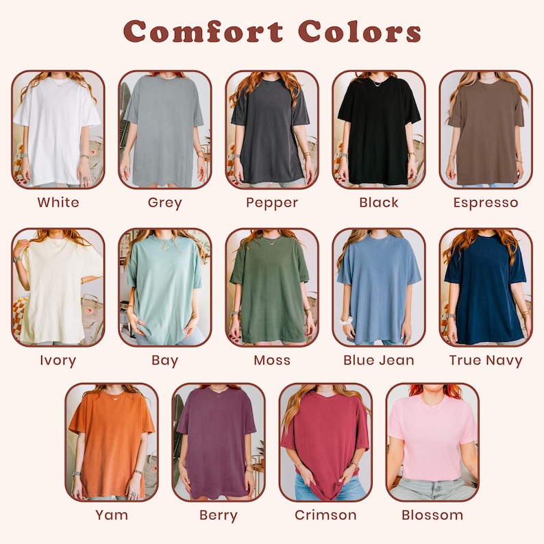 May include: A color chart titled Comfort Colors displaying twelve short-sleeve t-shirts in various shades: white, grey, pepper, black, espresso, ivory, bay, moss, blue jean, true navy, yam, berry, crimson, and blossom, each labeled with its color name.