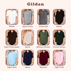 May include: A Gildan color chart featuring twelve short-sleeve t-shirts in various solid colors including white, sport grey, charcoal, black, dark chocolate, sand, military green, forest green, light blue, navy, maroon, and light pink.