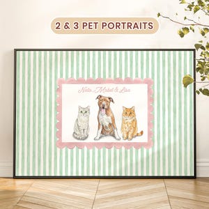 May include: A framed wall art print featuring a watercolor illustration of two cats and one dog. The pets are centered within a pink scalloped border on a light green and white striped background. The text Nala, Mabel & Lisa is printed above.