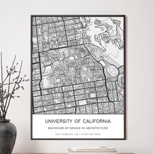 May include: A framed rectangular wall print featuring a black and white street map of the University of California. The text reads UNIVERSITY OF CALIFORNIA, BACHELOR OF DESIGN IN ARCHITECTURE, LOS ANGELES, CA | CLASS OF 2023 in a clean font.