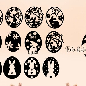 May include: A set of 13 black and white Easter egg designs featuring bunnies, flowers, butterflies, and the text "Frohe Ostern" (Happy Easter).