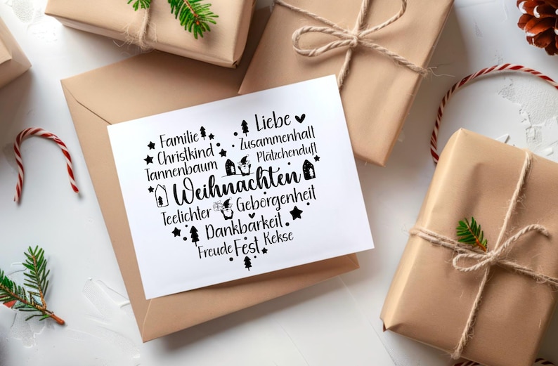 May include: A white card with black text and illustrations of houses and stars. The text reads "Familie, Christkind, Tannenbaum, Teelichter, Geborgenheit, Dankbarkeit, Freude Fest Kekse, Liebe, Zusammenhall, Pl&auml;tzchenduf", and "Weihnachten".