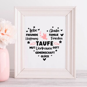 May include: White framed print with a pink dove and the word "TAUFE" in black. The print features a heart shape with the words "Liebe, Freunde, Hoffnung, Glaube, Familie, Frieden, Mut, Vertrauen, Gott, Gemeinschaft, Gl&uuml;ck" in black.