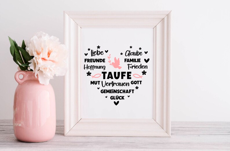 May include: White framed print with a pink dove and the word "TAUFE" in black. The print features a heart shape with the words "Liebe, Freunde, Hoffnung, Glaube, Familie, Frieden, Mut, Vertrauen, Gott, Gemeinschaft, Gl&uuml;ck" in black.