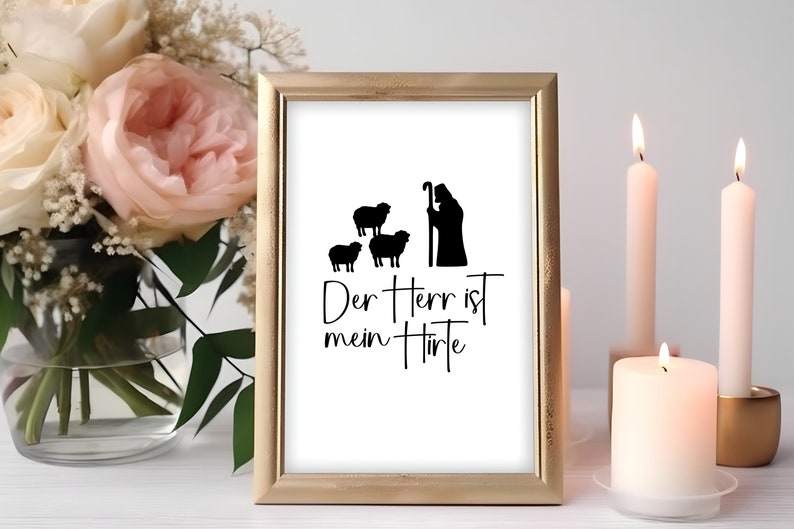 Peut inclure: Une impression encadr&eacute;e avec une silhouette noire et blanche d'un berger avec trois moutons. Le texte "Der Herr ist mein Hirte" est &eacute;crit sous l'image.