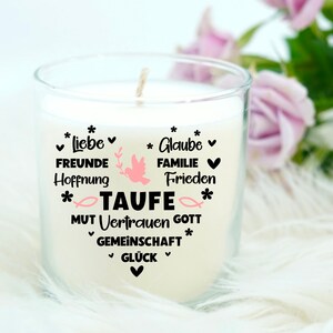 May include: White candle in a glass jar with a black heart design and the words "Liebe, Freunde, Hoffnung, Glaube, Familie, Frieden, Taufe, Mut, Vertrauen, Gott, Gemeinschaft, Gl&uuml;ck" in German.