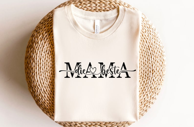 May include: A white t-shirt with the text "MAMA die beste" in black lettering with a heart symbol.