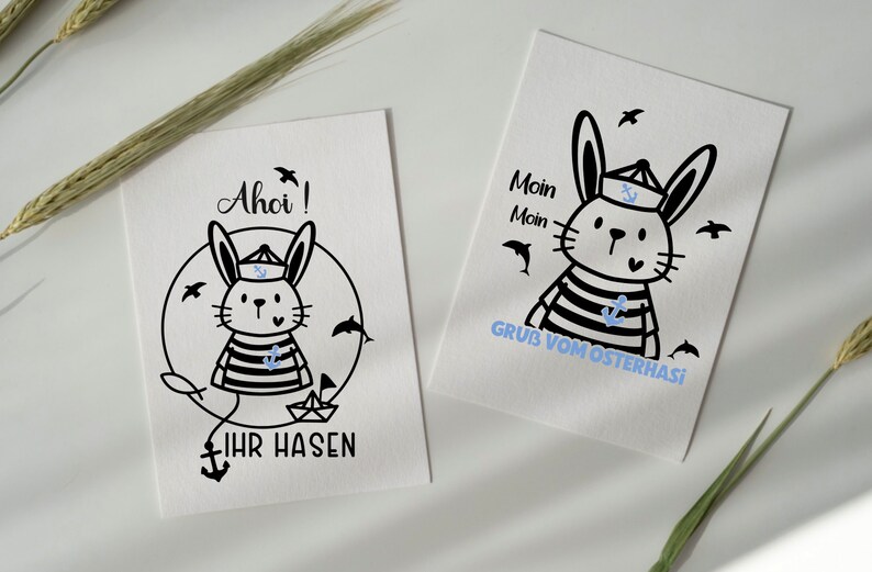 May include: A black and white illustration of a rabbit dressed as a sailor with the text "Ahoi!" and "Ihr Hasen" on a white background.