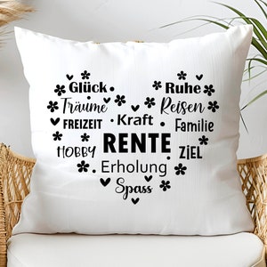 May include: White throw pillow with black text that reads "* Gl&uuml;ck. * Ruhe * * Tr&auml;ume * Reisen * FREIZEIT. Kraft. Familie * * HOBBY RENTE ZIEL * . Erholung * Spass *"