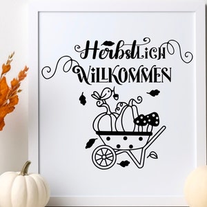 May include: Black and white illustration of a wheelbarrow filled with pumpkins and mushrooms. The text "Herbstlich Willkommen" is written in a decorative font above the wheelbarrow.