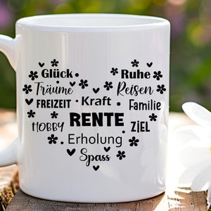 May include: White ceramic mug with black text that reads "* Gl&uuml;ck. * Tr&auml;ume * * Ruhe * Reisen * ✔ FREIZEIT. Kraft &bull; Familie * HOBBY RENTE ZIEL * . Erholung * ✓ Spass *"
