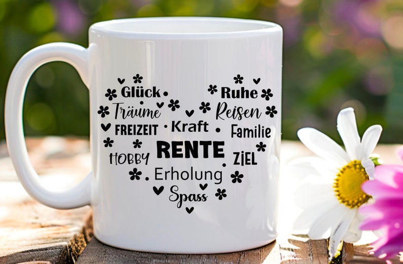 May include: White ceramic mug with black text that reads "* Gl&uuml;ck. * Tr&auml;ume * * Ruhe * Reisen * ✔ FREIZEIT. Kraft &bull; Familie * HOBBY RENTE ZIEL * . Erholung * ✓ Spass *"