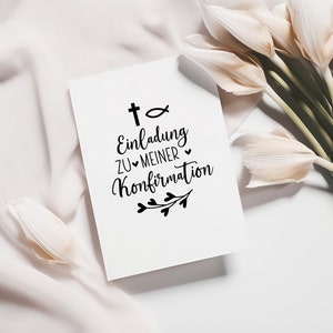 May include: A white card with black text that reads "t+ Einlading zu meiner Konfirmation" with a cross, fish symbol, and small floral design.
