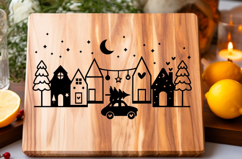 May include: A wooden cutting board with a black silhouette design of a town with houses, trees, a car carrying a Christmas tree, and a crescent moon with stars.