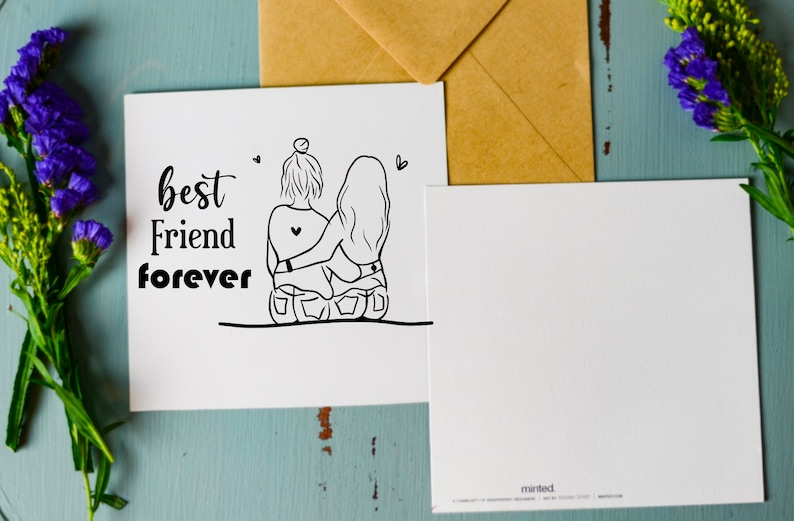 May include: A white card with black text that reads "best friend forever". The card features a line drawing of two women sitting back to back with their arms around each other.