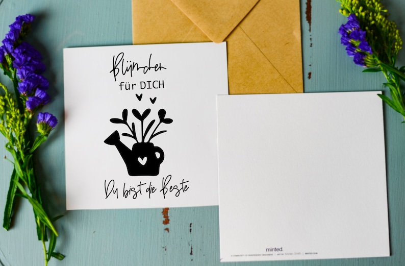 May include: A white card with black text and a black silhouette of a watering can with flowers and hearts. The text reads "Bl&uuml;mchen f&uuml;r DICH" and "Du bist die Beste".