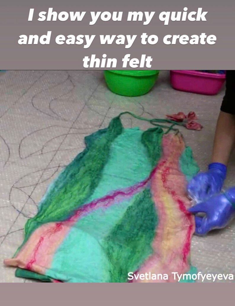 May include: A close-up of a colorful, thin felt fabric being felted by hand. The fabric is green, pink, and yellow. The fabric is being felted on a white surface with a black grid pattern. The text "Svetlana Tymofeyeva" is visible in the bottom right corner of the image.