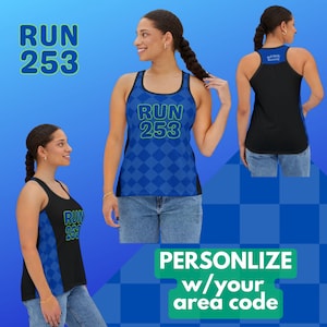 May include: A black and blue tank top with a green and white graphic that says "RUN 253". The tank top is shown on a model wearing blue jeans. The text "PERSONALIZE w/ your area code" is shown in green on a white background.