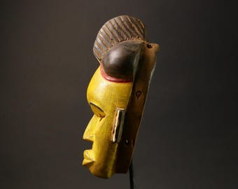 ヴィンテージ バウレ アフリカンマスク：手彫りの黄色い木製壁飾り