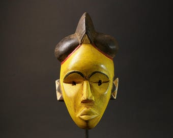 アフリカンマスク 木製 緑と黄色 ヴィンテージ バウレ アフリカンマスク：手彫りの黄色い木製壁飾り
