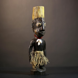 African statue Yoruba figure with yellow crest and skirt – Handcrafted tribal art sculpture for cultural decor display -G4874