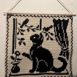 crochet cat in windowsill tapestry