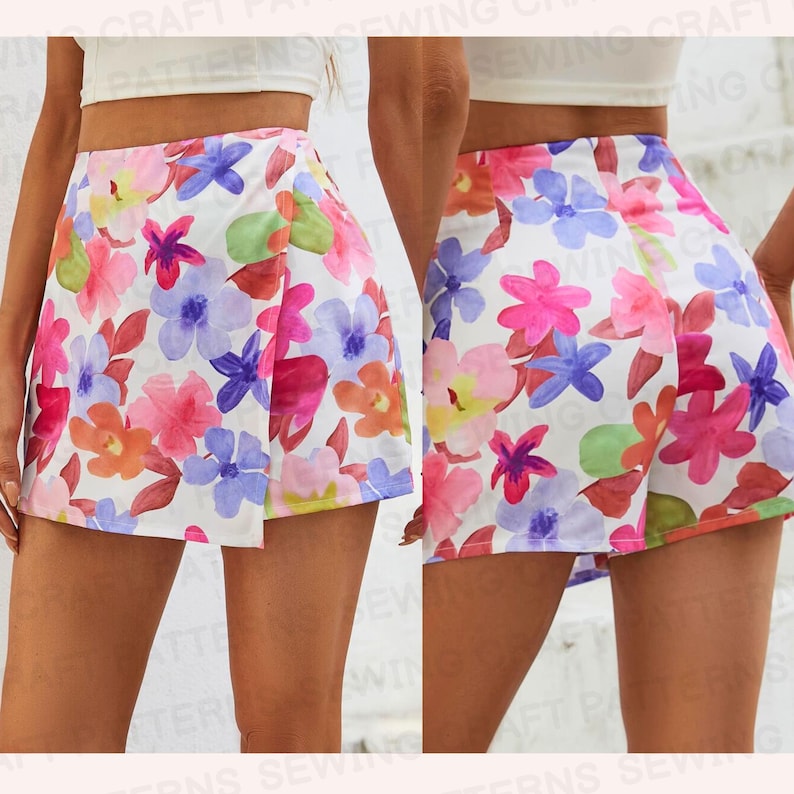May include: White shorts with a floral print featuring pink, blue, and orange flowers. The shorts have a wrap-around style and a high waist.