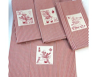 Juego de cuatro paños de cocina/manteles individuales a rayas estilo tics francés en rojo/natural, con bordado a mano.