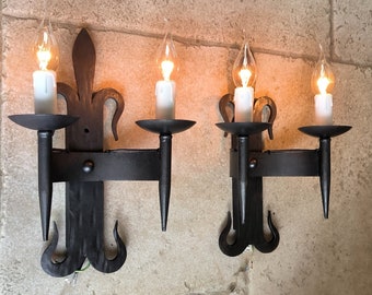 Beautiful pair of vintage, French, handmade, gothic, fleur-de-lis style, wrought iron, wall sconces. Circa 1950's / 60's