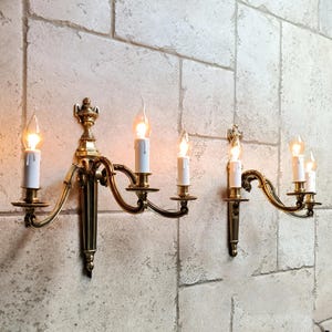 Beautiful pair of antique, French, Louis XVI style, bronze wall sconces. Circa early 1900s