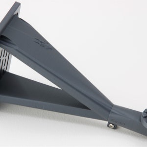 May include: A gray plastic wall mount with a rectangular base and a long, angled arm. The arm has a square connector at the end with a screw.