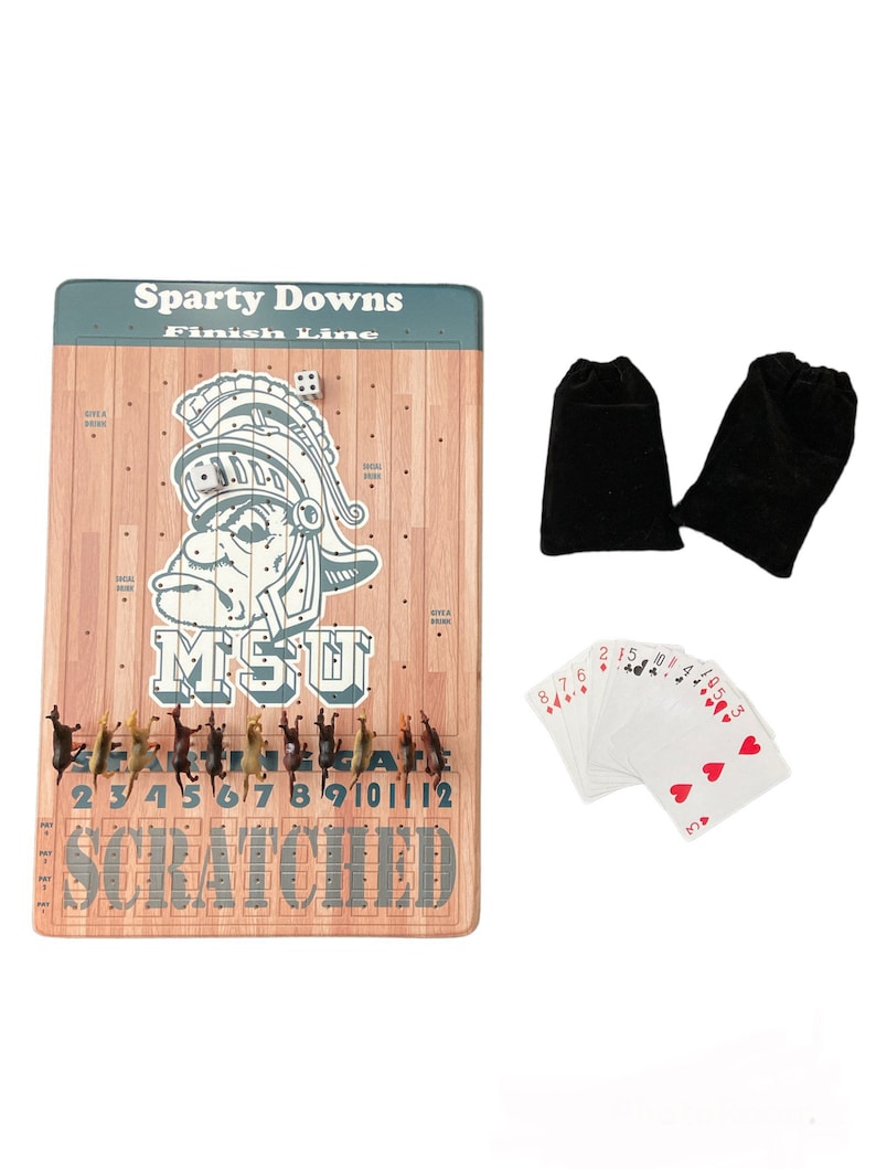 May include: A wooden game board with a green and brown finish. The board features a horse racing theme with a Spartan helmet logo and the text "Sparty Downs Finish Line". The board includes a set of horses, dice, and playing cards.