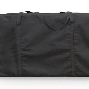 May include: A black canvas carrying case with two handles and a zipper closure.