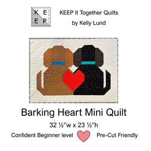 May include: A mini quilt pattern featuring two dogs, one brown and one black, with a red heart between them. The quilt is titled "Barking Heart Mini Quilt" and measures 32 1/2 inches wide by 23 1/2 inches high. The pattern is described as "Confident Beginner level" and "Pre-Cut Friendly".