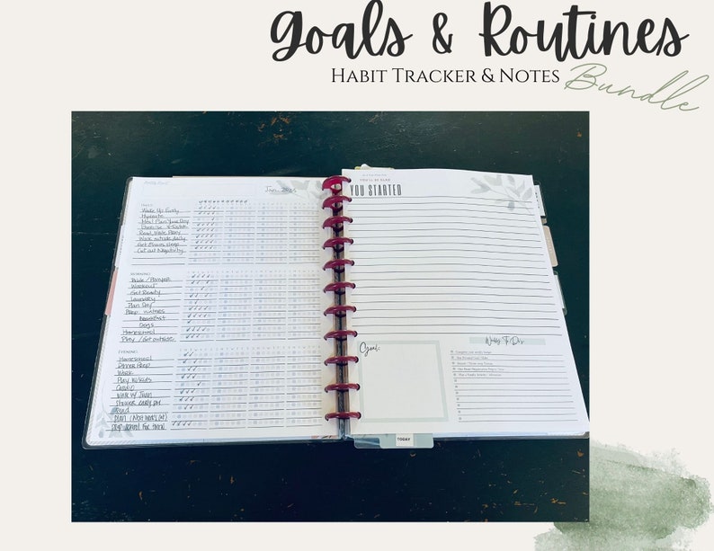 May include: An open planner with a red binding and a white cover. The planner has a habit tracker on the left page and a "Goals & Routines" section on the right page. The planner is labelled "Habit Tracker & Notes Bundle".