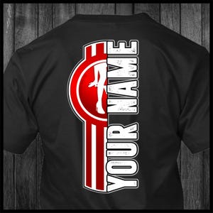 May include: Black t-shirt with a red and white graphic design featuring a woman in a high heel and the text "YOUR NAME".